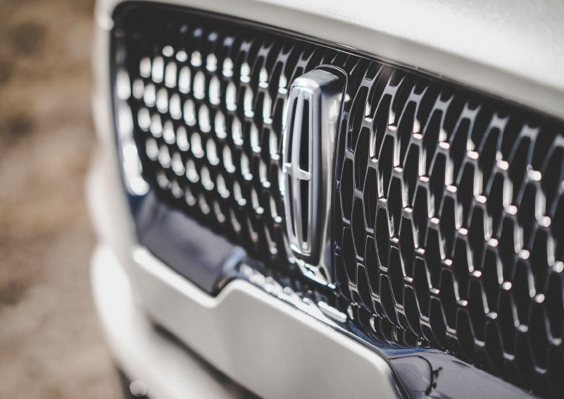The grille of the 2024 Lincoln Aviator® Reserve model with an eye-catching repeated field of Lincoln Star logo shapes | Preston Lincoln in Hurlock MD