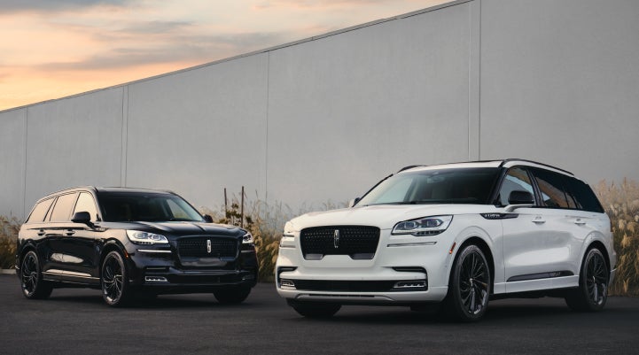 Two Lincoln Aviator® SUVs are shown with the available Jet Appearance Package | Preston Lincoln in Hurlock MD